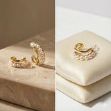 Caellia 14K gold filled hoop earrings featuring a row of lustrous freshwater pearls.