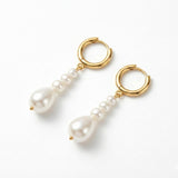 Caellia 14K gold hoop earrings featuring dangling baroque freshwater pearls.