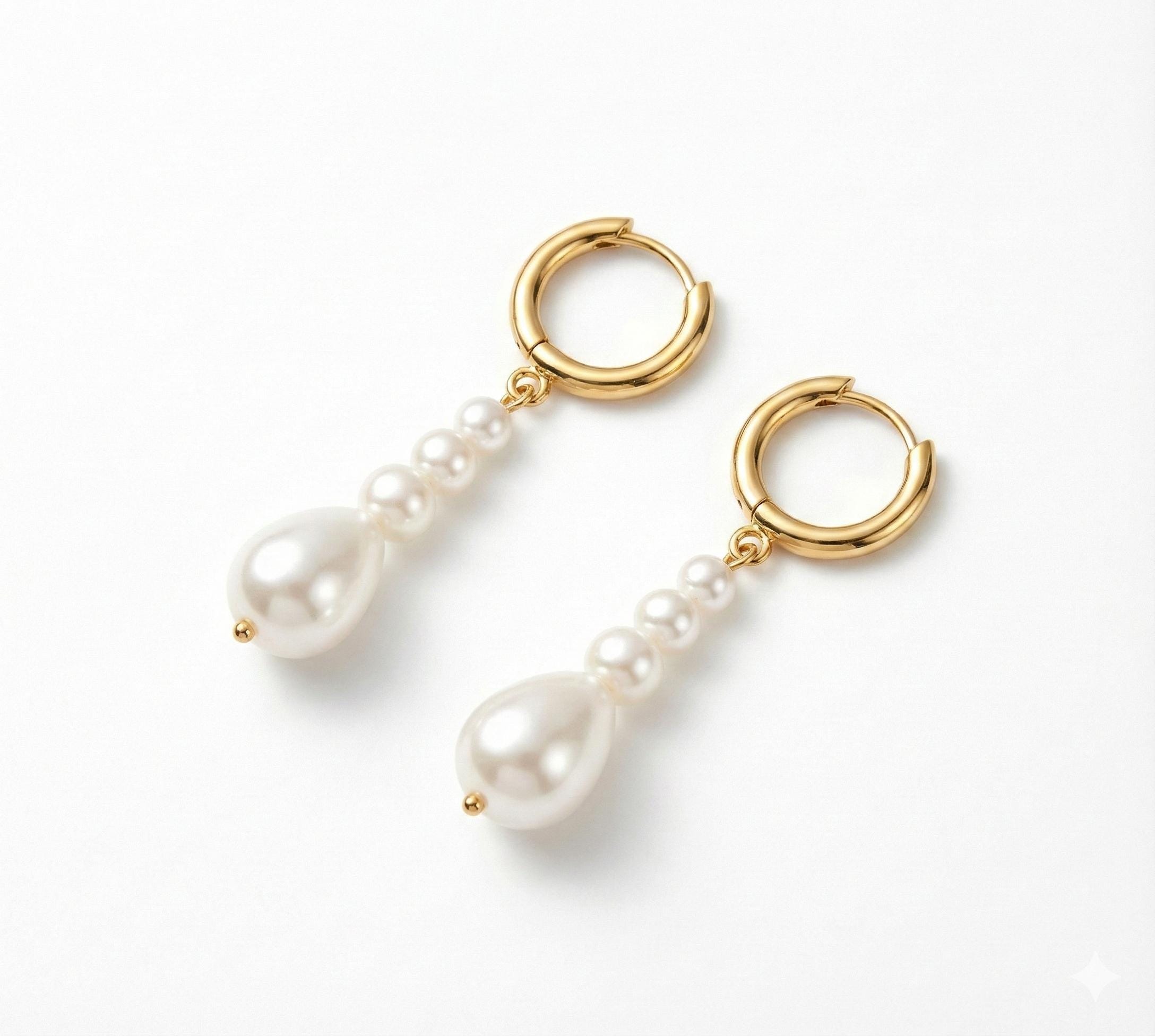 Caellia 14K gold hoop earrings featuring dangling baroque freshwater pearls.