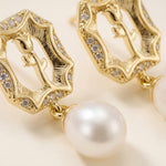 Macro close-up of openwork rose motifs sparkling accents and pearl drops