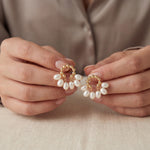 Pearl earrings listing image - Editorial hands shot