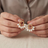Pearl earrings listing image - Editorial hands shot