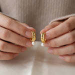 Pearl earrings listing image - Editorial hands shot