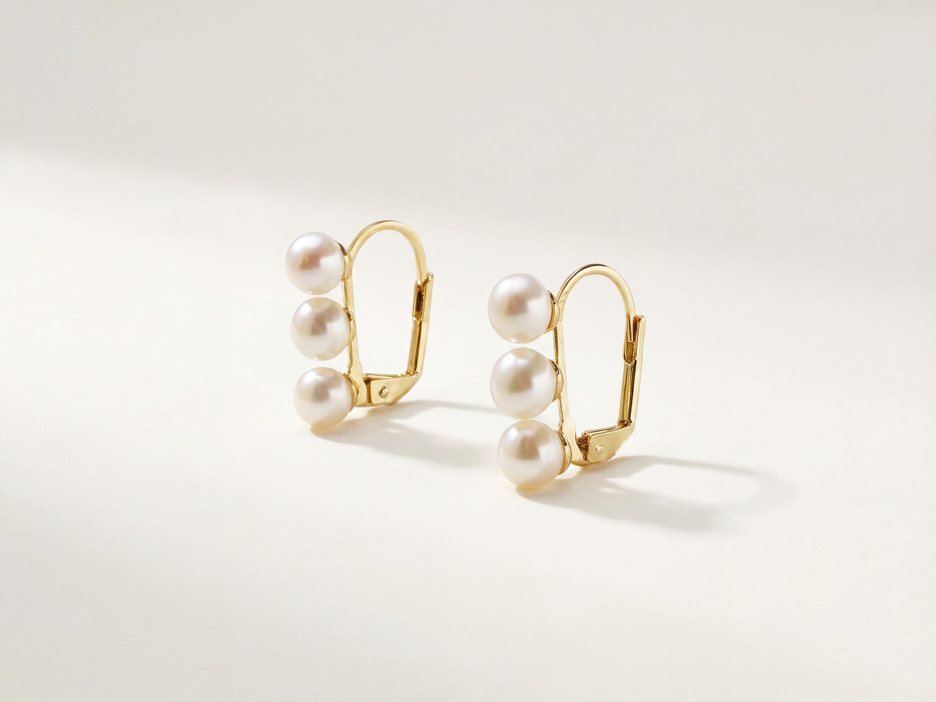 Front product view of matching triple freshwater pearl leverback earrings