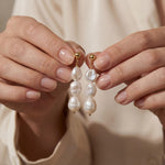 Pearl earrings listing image - Editorial hands shot