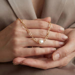 Pearl necklace listing image - Soft editorial hands shot