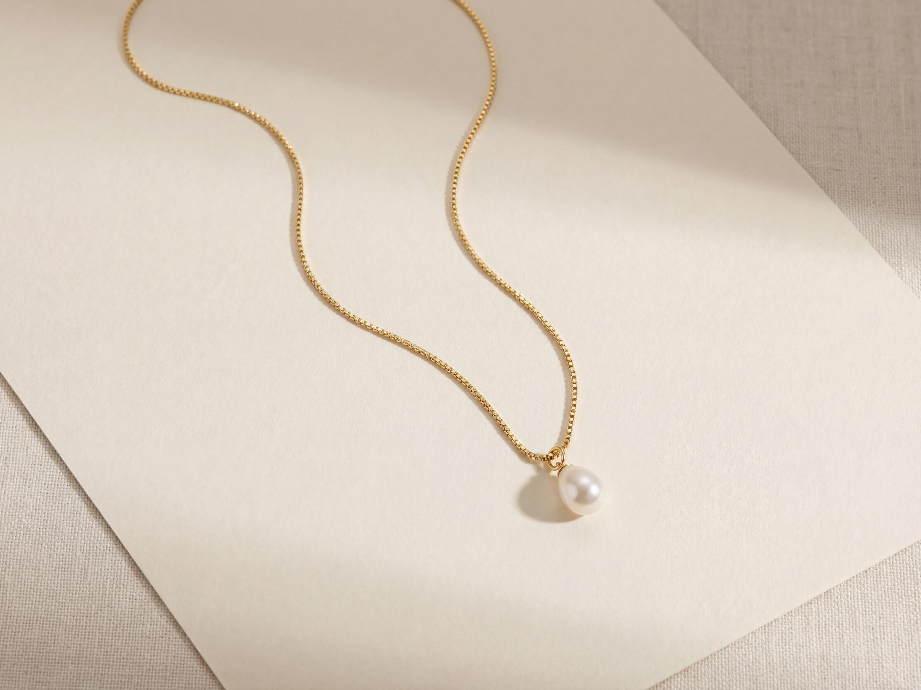 Pearl necklace listing image - Flat lay luxury shot