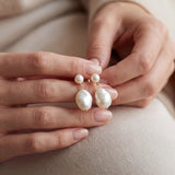 Pearl earrings listing image - Editorial hands shot