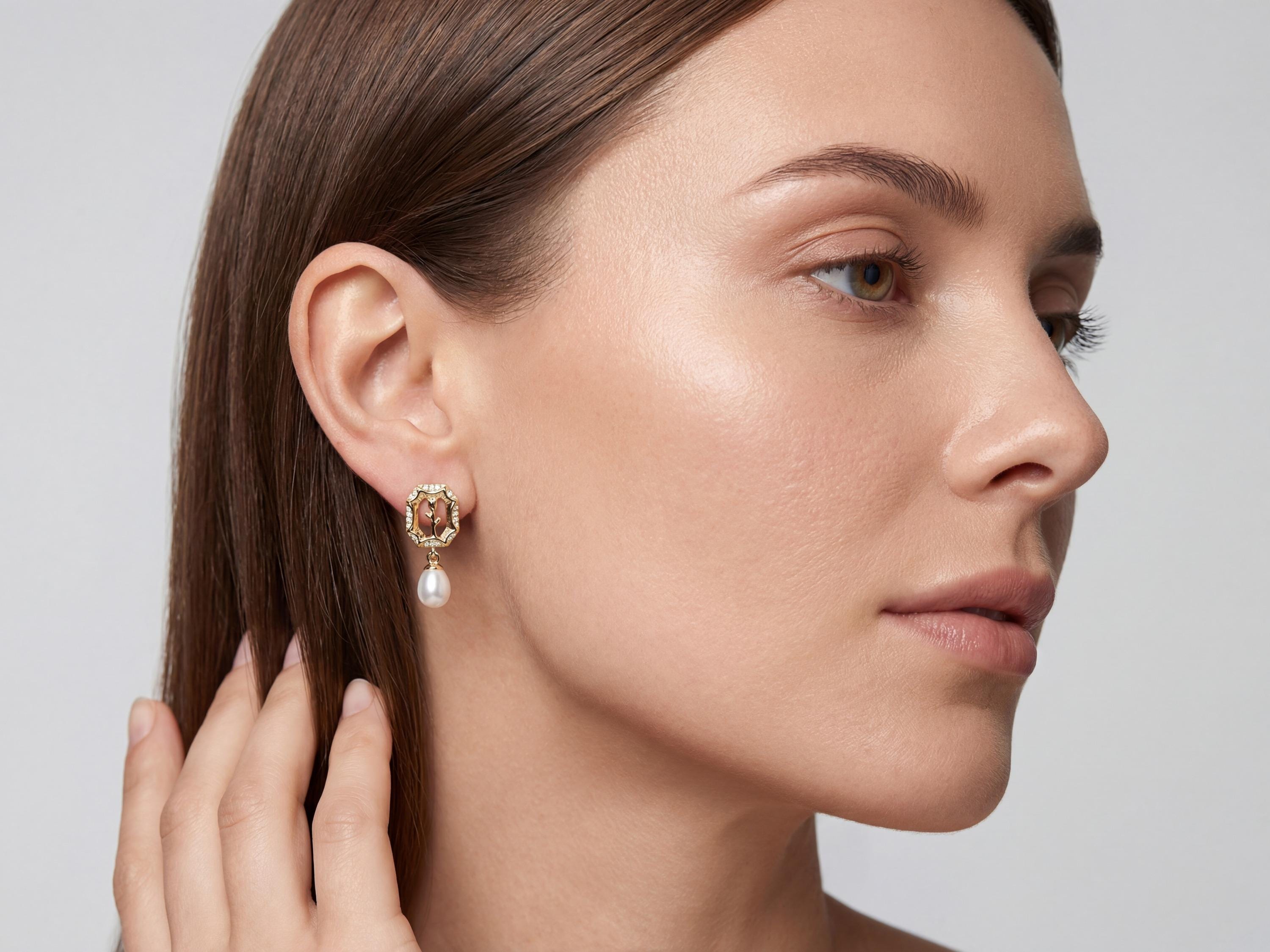 Model wearing a gold rose frame pearl drop stud earring in side profile
