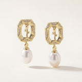 Matching openwork gold rose earrings with sparkling borders and pearl drops
