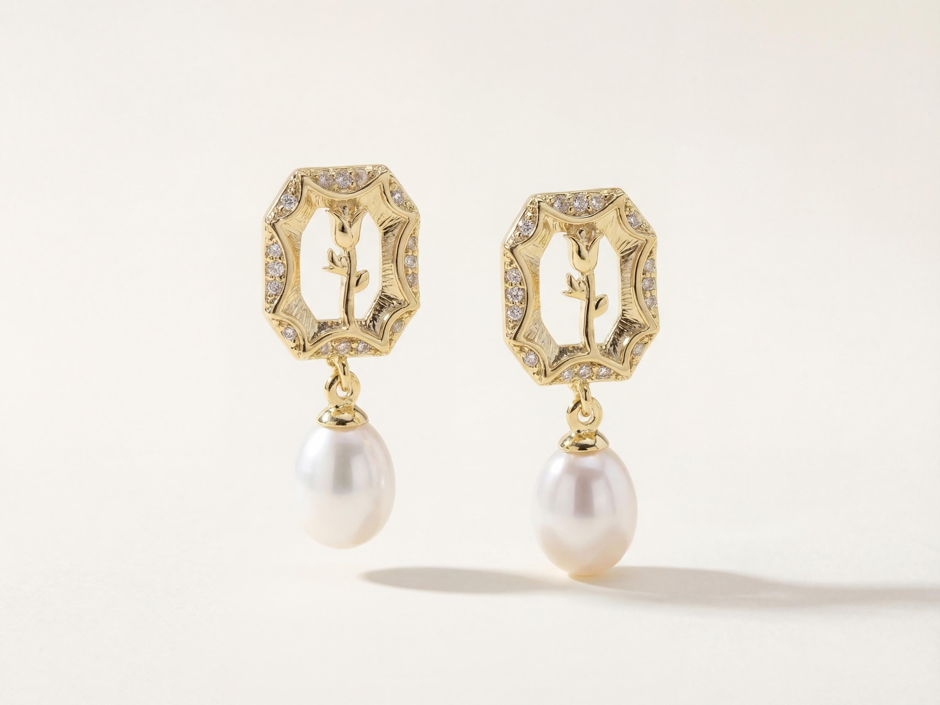 Matching openwork gold rose earrings with sparkling borders and pearl drops