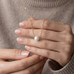 Pearl necklace listing image - Soft editorial hands shot