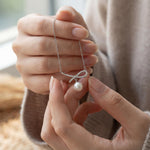 Pearl necklace listing image - Soft editorial hands shot