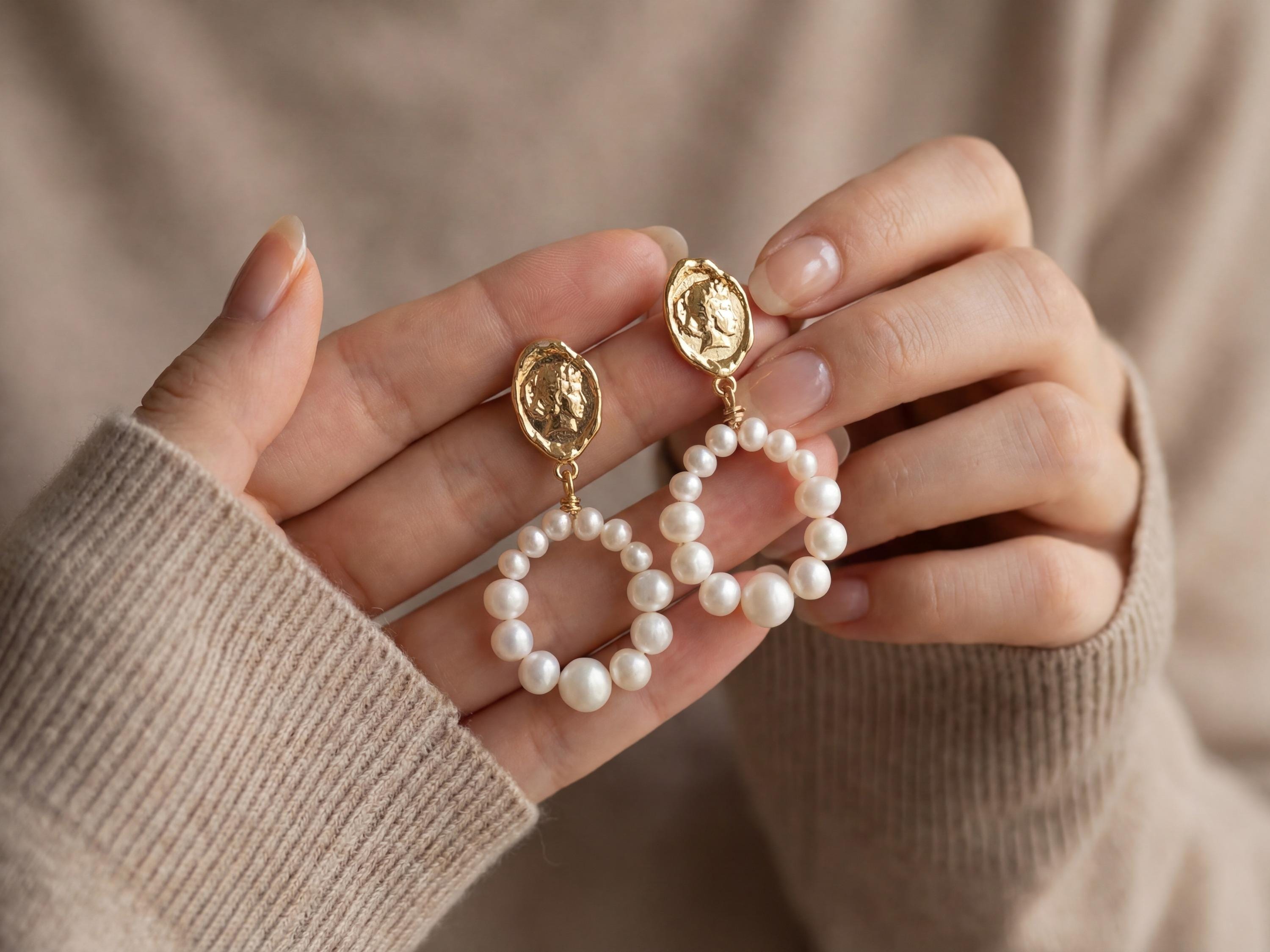 Pearl earrings listing image - Editorial hands shot