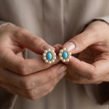 Pearl earrings listing image - Editorial hands shot