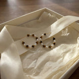 Tiger eye pearl hoop earrings presented in a gift box with ribbon