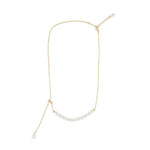 Gold-plated necklace with a string of rice-shaped pearls and an adjustable chain.