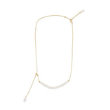 Gold-plated necklace with a string of rice-shaped pearls and an adjustable chain.