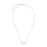 A gold chain necklace with three white pearls and two gold beads.