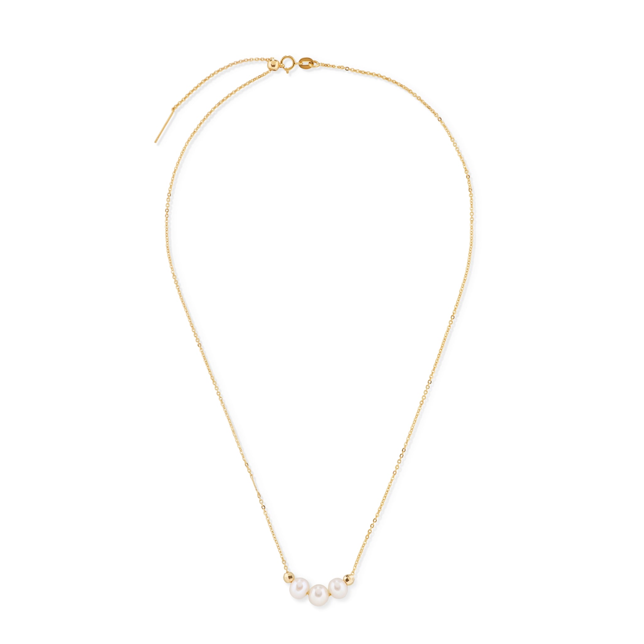 A gold chain necklace with three white pearls and two gold beads.