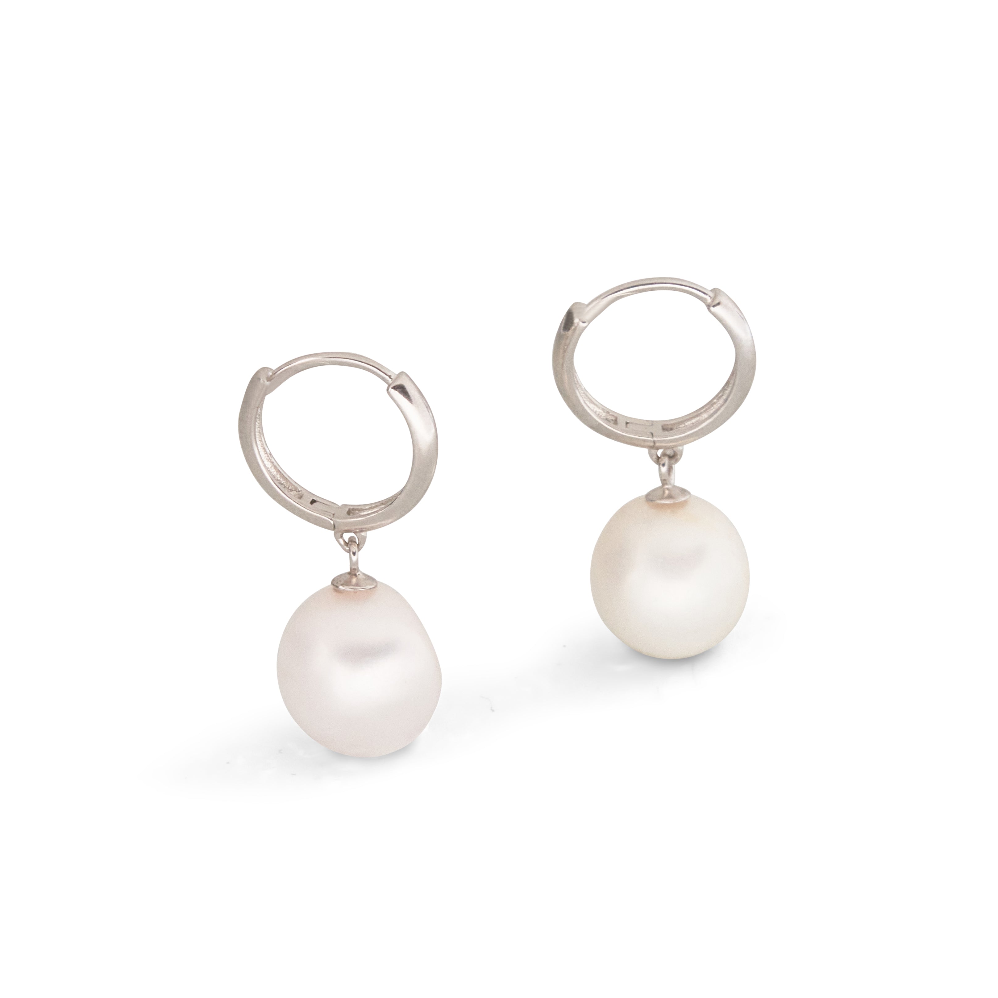 Two silver hoop earrings with white freshwater pearl drops are shown on a white background.