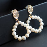 Gold-plated freshwater pearl hoop earrings with a vintage-inspired coin stud.