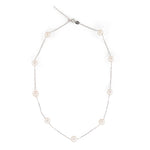 A dainty pearl necklace with a 14K gold-plated chain and eleven pearls.
