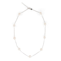 A dainty pearl necklace with a 14K gold-plated chain and eleven pearls.